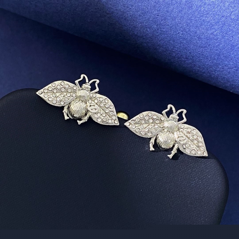 G*u*i earrings